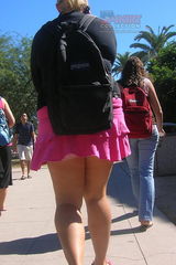 School girls up skirt. Hot teenie in pink mini